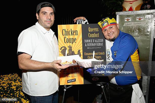 Chefs Donnie D'Alessio and Hernan Heras of Queens Comfort pose with their dish Cinnamon Toast Crunch Chicken Fingers, Bourban Maple Syrup at Chicken...