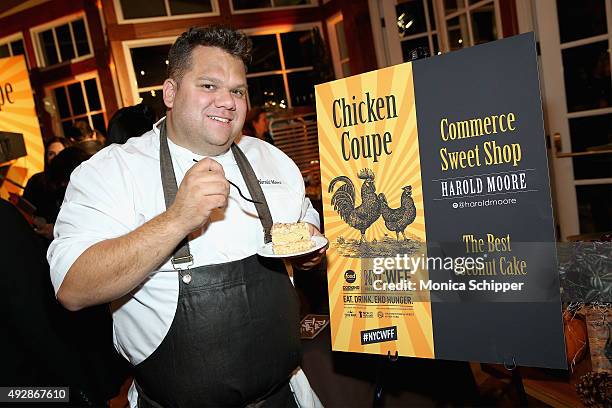 Harold Moore of Harold's Meat+Three and Commerce Sweet Shop poses with his dessert; The Best Coconut Cake at Chicken Coupe hosted by Whoopi Goldberg...