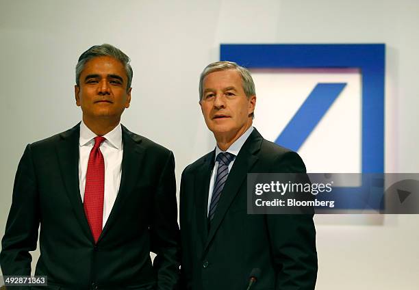 Anshu Jain, co-chief executive officer of Deutsche Bank AG, left, poses for a photograph with Juergen Fitschen, co-chief executive officer of...