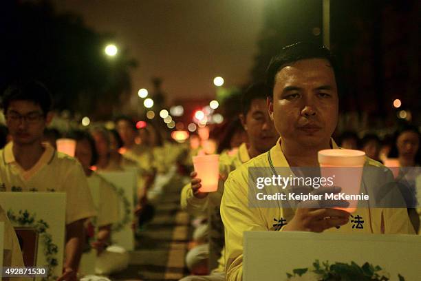 Members of the Falun Gong a.k.a Falun Dafa spiritual group attend a silent protest outside of the Chinese Consulate on October 15, 2015 in Los...