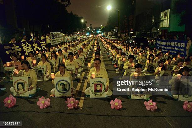 Members of the Falun Gong a.k.a Falun Dafa spiritual group attend a silent protest outside of the Chinese Consulate on October 15, 2015 in Los...