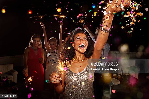 friends celebrating at new year's eve party - party people stockfoto's en -beelden