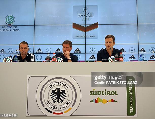 Germany´s manager Oliver Bierhoff , press officer Jens Grittner and Germany´s assistant coach Hans-Dieter Flick answer questions during the press...