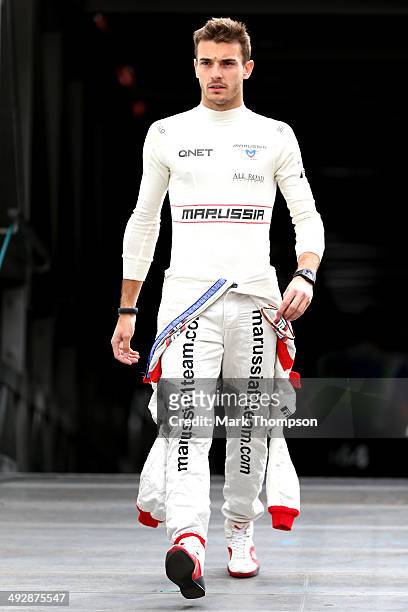 Jules Bianchi of France and Marussia walks across the paddock during practice ahead of the Monaco Formula One Grand Prix at Circuit de Monaco on May...