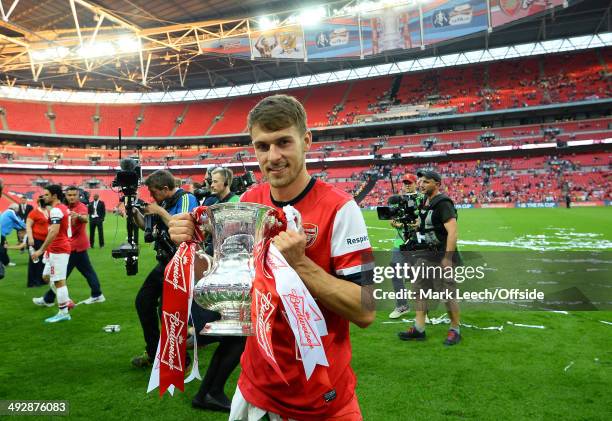 Aaron Ramsey of Arsenal holds the FA Cup during the FA Cup with Budweiser Final match between Arsenal and Hull City at Wembley Stadium on May 17,...