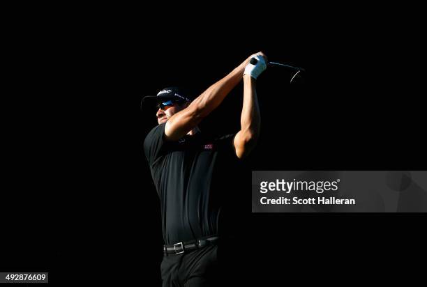 Adam Scott tees off on the 11th during Round One of the Crowne Plaza Invitational at Colonial on May 22, 2014 at Colonial Country Club in Fort Worth,...