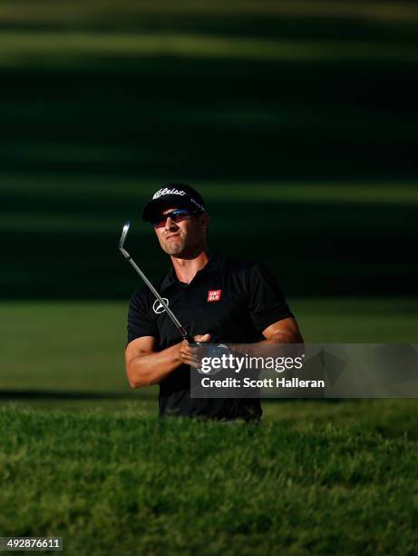 Adam Scott takes his shot out of the bunker on the 11th during Round One of the Crowne Plaza Invitational at Colonial on May 22, 2014 at Colonial...