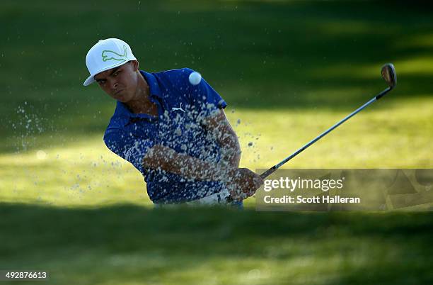 Rickie Fowler takes his shot out of the bunker on the 10th during Round One of the Crowne Plaza Invitational at Colonial on May 22, 2014 at Colonial...