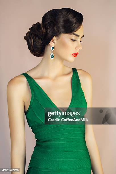 beautiful woman wearing cocktail dress - woman cocktail dress stock pictures, royalty-free photos & images