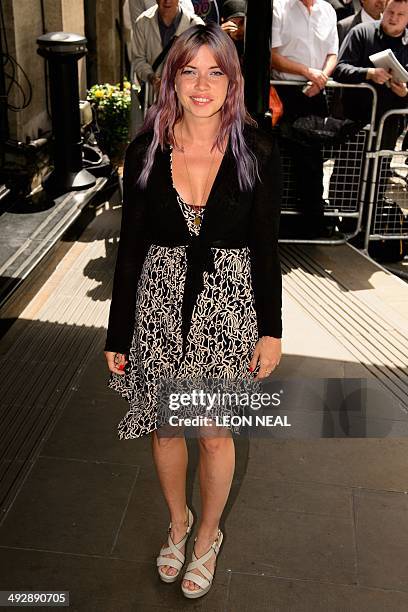 British musician Erin K arrives at the Ivor Novello awards at the Grosvenor Hotel in central London, on May 22, 2014. AFP PHOTO/Leon Neal