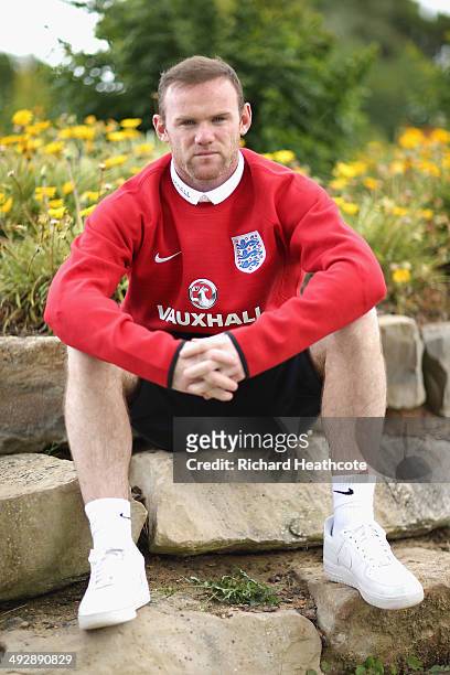 Wayne Rooney poses for a picture after a press conference at the England pre-World Cup Training Camp at the Vale Do Lobo Resort on May 21, 2014 in...