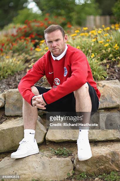 Wayne Rooney poses for a picture after a press conference at the England pre-World Cup Training Camp at the Vale Do Lobo Resort on May 21, 2014 in...