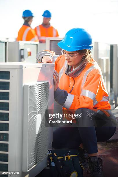 female air conditioning engineer - hvac repair stock pictures, royalty-free photos & images