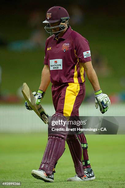 Peter Forrest of Queensland leaves the field after being dismissed by Steve O'Keefe of NSW during the Matador BBQs One Day Cup match between...