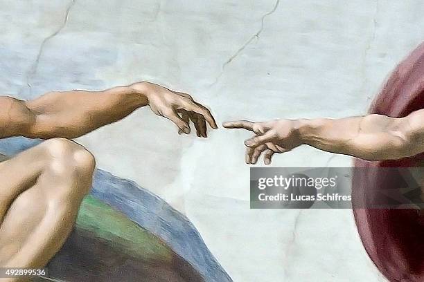 The Creation of Adam by Michelangelo is painted on the ceiling of the Sistine Chapel, in the Vatican Museums on August 4 in Rome, Italy. The Creation...