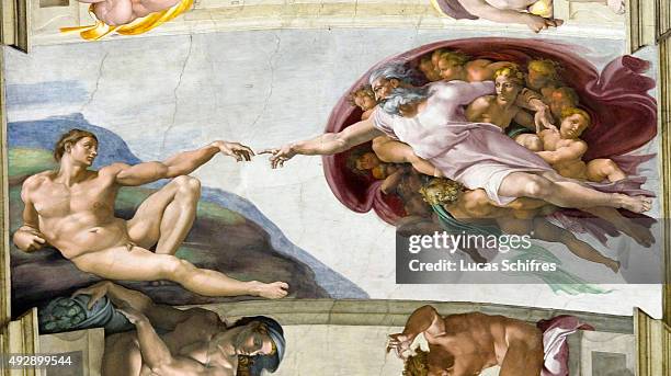 The Creation of Adam by Michelangelo is painted on the ceiling of the Sistine Chapel, in the Vatican Museums on August 4 in Rome, Italy. The Creation...