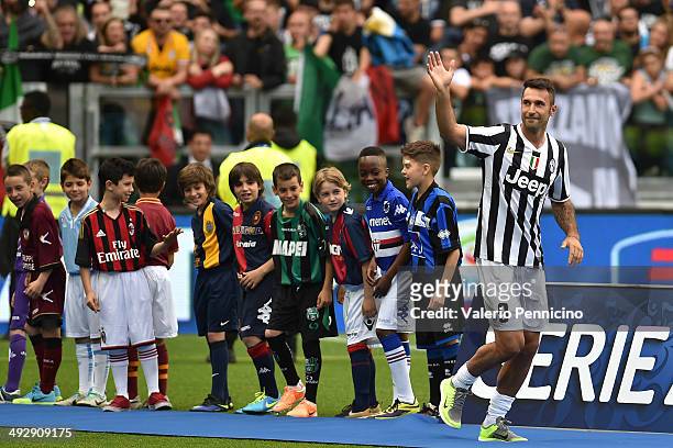 Mirko Vucinic of Juventus FC celebrates win the Serie A trophy at the end of the Serie A match between Juventus and Cagliari Calcio at Juventus Arena...