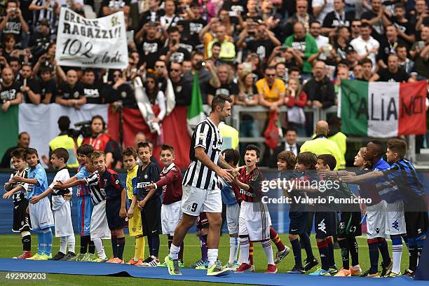 Mirko Vucinic of Juventus FC celebrates win the Serie A trophy at the end of the Serie A match between Juventus and Cagliari Calcio at Juventus Arena...