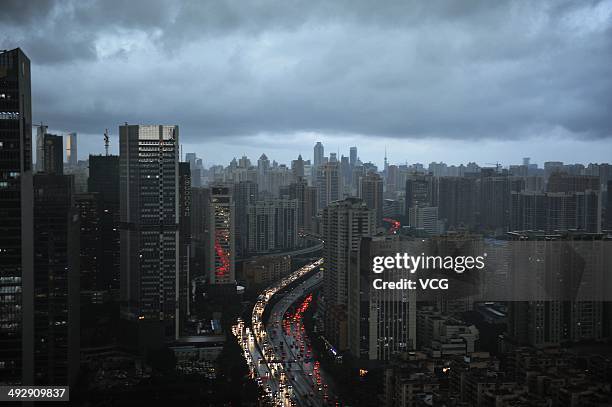 Dark clouds cover the city's skyline on May 22, 2014 in Guangzhou, Guangdong Province of China. Heavy rainstorms expected to batter the southern...