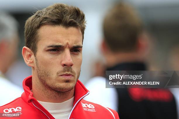 Marussia's French driver Jules Bianchi looks on in the pits of the Monaco street circuit during the second practice session of the Monaco Formula One...