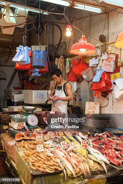 butcher fish, at the old fish market hong kong,china - wanchai stock pictures, royalty-free photos & images