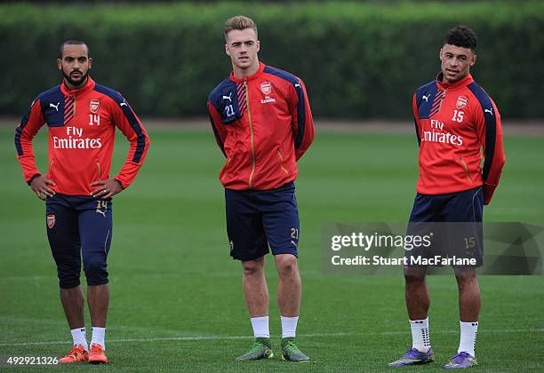 Theo Walcott, Calum Chambers and Alex Oxlade-Chamberlain of Arsenal during a training session at London Colney on October 16, 2015 in St Albans,...