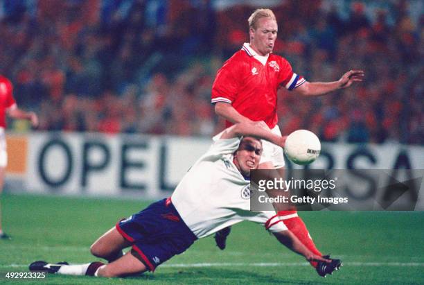 England captain David Platt is fouled by Holland captain Ronald Koeman and in a controversial decision, no penalty is given, during the World Cup...