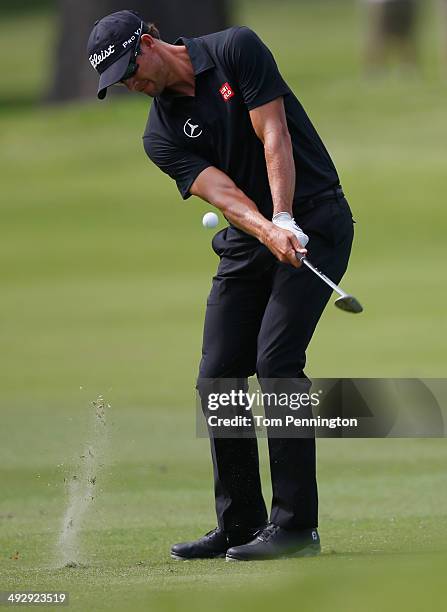 Adam Scott of Australia takes his shot on the 2nd during Round One of the Crowne Plaza Invitational at Colonial on May 22, 2014 at Colonial Country...