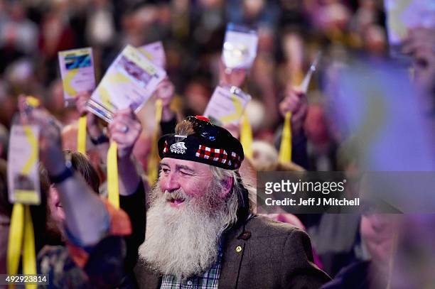 Delegate votes during a motion on day two of the 81st annual SNP conference at the Aberdeen Exhibition and Conference Centre on October 16, 2015 in...