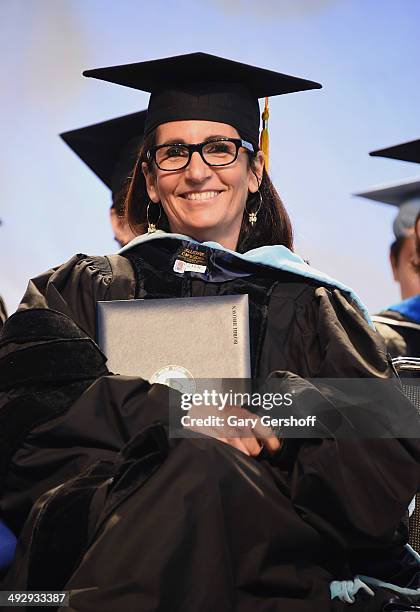 Makeup artist Bobbi Brown receives an honorary degree from the Fashion Institute of Technology at Javits Center on May 22, 2014 in New York City.