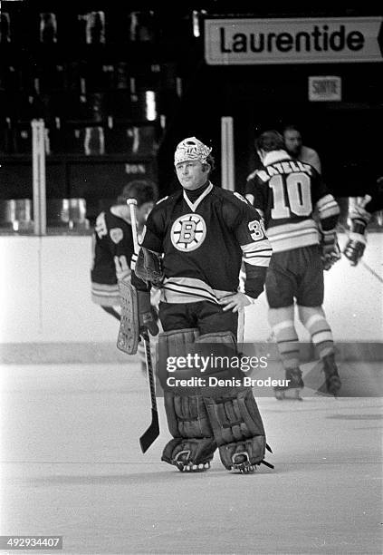 Gerry Cheevers of the Boston Bruins stands on the ice before a game against the Montreal Canadiens at the Montreal Forum circa 1970 in Montreal,...
