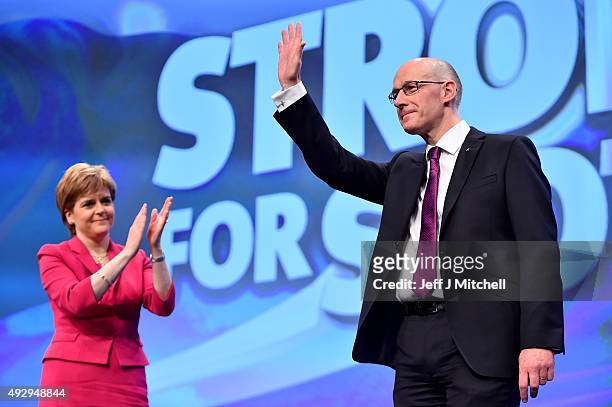 Scotland's Deputy First Minister, John Swinney, is applauded by First Minister Nicola Sturgeon following his speech during the afternoon session on...