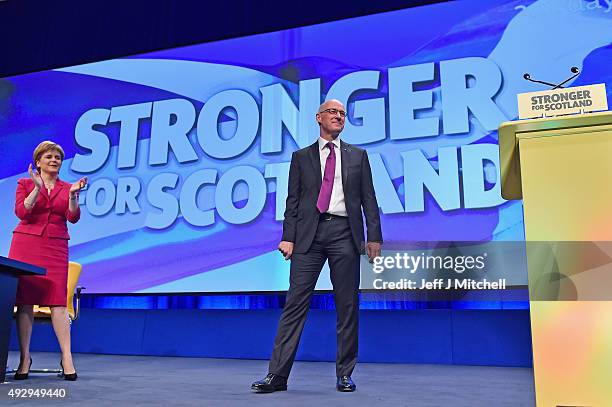 Scotland's Deputy First Minister, John Swinney, is applauded by First Minister Nicola Sturgeon following his speech during the afternoon session on...