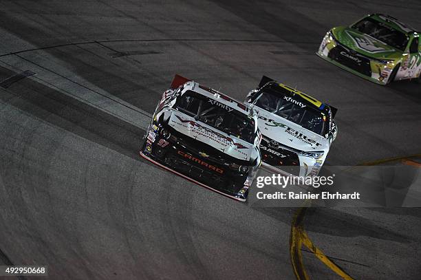 Dylan Kwasniewski, driver of the Vroom Brands Chevrolet, races with Blake Koch, driver of the LeafFilter Gutter Protection Toyota, during the NASCAR...