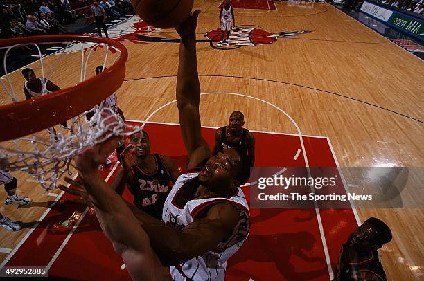 Othella Harrington of the Houston Rockets goes to the basket during the game of the Seattle SuperSonics on January 19, 1998 at the Compaq Center in...