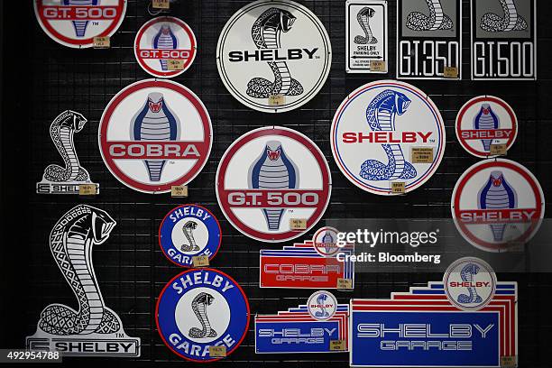 Shelby Cobra signs are displayed for sale inside the gift shop at the Shelby American Inc. World headquarters in Las Vegas, Nevada, U.S., on...