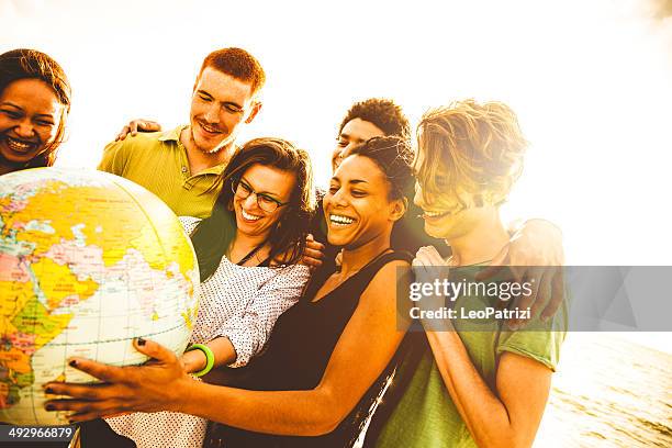 group of friends holding an earth globe - the most beautiful girl in the world 個照片及圖片檔