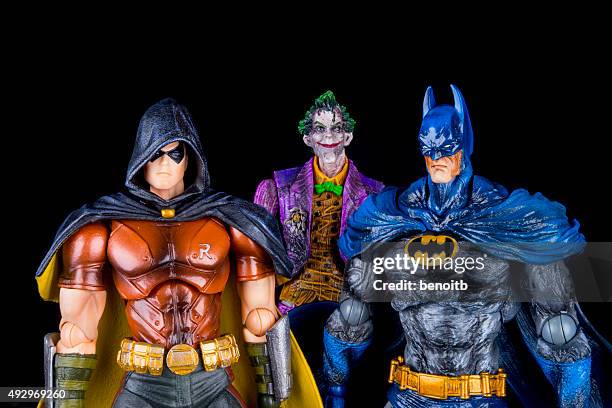 batman with robin and the joker - dc comics stock pictures, royalty-free photos & images