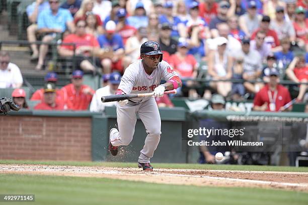 Jonathan Herrera of the Boston Red Sox sacrifice bunts as he bats against the Texas Rangers at Globe Life Park in Arlington on May 11, 2014 in...