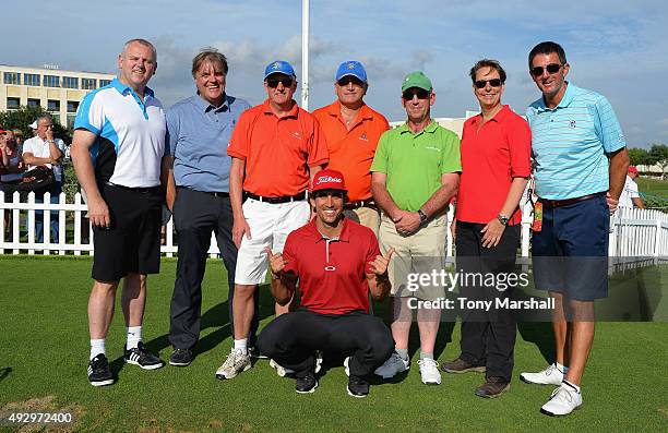 Rafa Cabrera-Bello of Spain poses for a group photo with participants of the golf cliinic during the second day of the Portugal Masters at Oceanico...