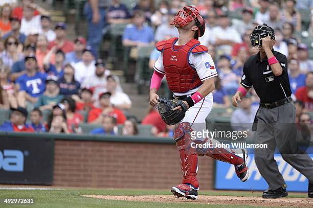 Catcher J.P. Arencibia of the Texas Rangers fields his position as he runs to catch a foul fly ball in the game against the Boston Red Sox at Globe...
