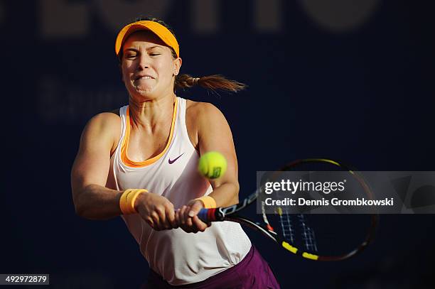 Eugenie Bouchard of Canada plays a backhand in her match against Yaroslava Shvedova of Kazakhstan during Day 6 of the Nuernberger Versicherungscup on...