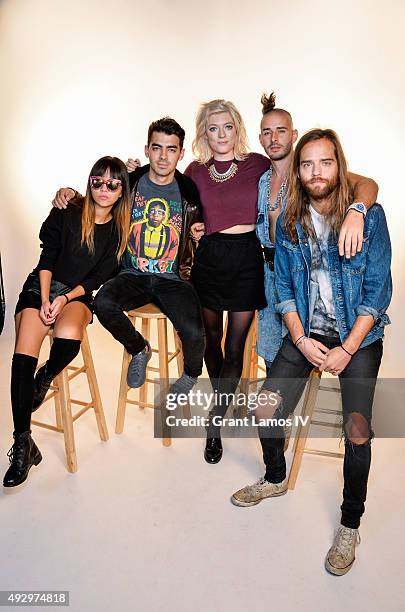 Members of the group DNCE, JinJoo Lee, Joe Jonas, Cole Whittle and Jack Lawless pose with Music Choice Countdown Host Sophie Sumner at Music Choice...