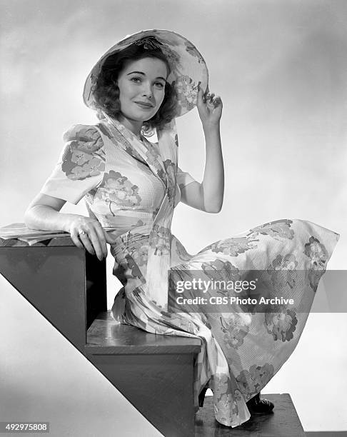 Lois Collier, CBS Radio actress in the Irene Rich serial drama, Dear John. She models some fashionable clothing. Image dated October 18, 1940....