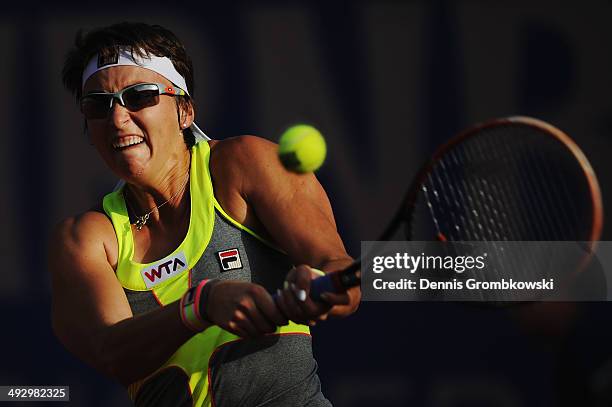 Yaroslava Shvedova of Kazakhstan plays a backhand during her match against Eugenie Bouchard of Canada during Day 6 of the Nuernberger...