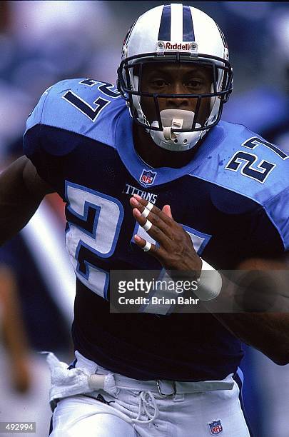 Eddie George of the Tennessee Titans runs down the field during a game against the Cleveland Browns at the Adelphia Coliseum in Nashville, Tennessee....