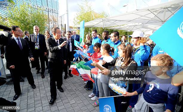 United Nations Secretary General Ban Ki-moon greets the children holding UN flags during the World Food Day event at Expo Milan in Milan, Italy on...