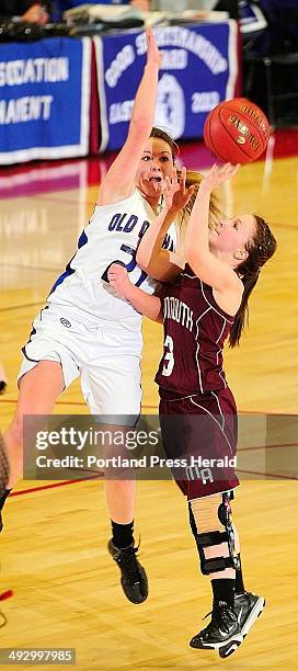 Old Orchard Beach's Abigail Dubois, left, tries to stop shot by Monmouth Academy's Ashley Coulombe during an Western Class C tournament game on...