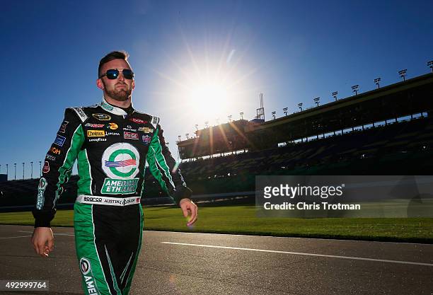 Austin Dillon, driver of the American Ethanol Chevrolet, walks down pit road prior to qualifying for the NASCAR Sprint Cup Series Hollywood Casino...