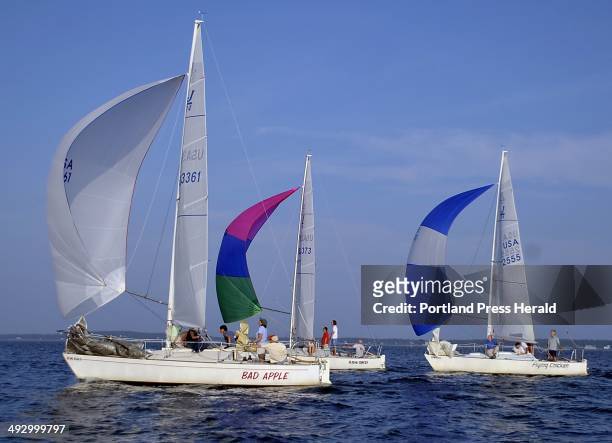 Wednesday, August 4, 2010. The Bad Apple stays close to the lead as they perform a spinaker assisted breach down wind on the second leg of the race...